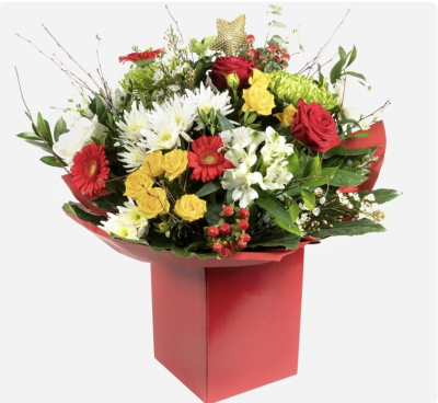 Jolly Christmas hand tied bouquet - A hand tied bouquet of bright Christmas flowers, beautifully wrapped and presented in a gift box of water.