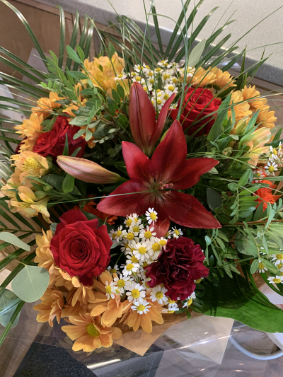 Autumn bouquet - A lovely mix of warm, autumnal shades of flowers and seasonal foliage. Hand tied and aqua packed in a gift box of water.